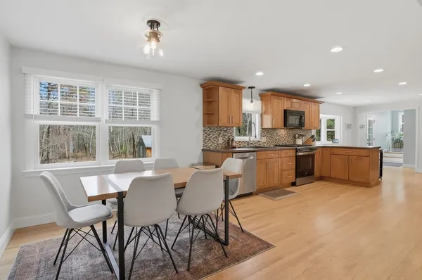 a view of a dining room with furniture window and outside view