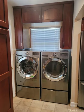 a view of a washer and dryer in a utility room