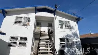 a front view of a house with stairs