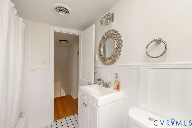a bathroom with a sink a vanity and a mirror