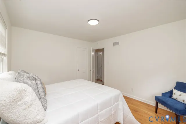 a view of a room with gym equipment and large windows