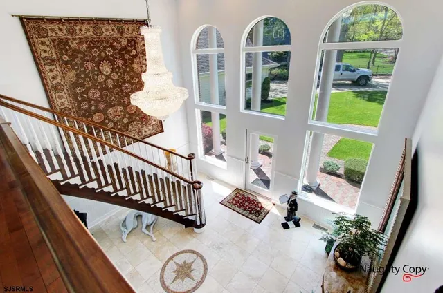 a view of balcony with furniture and garden