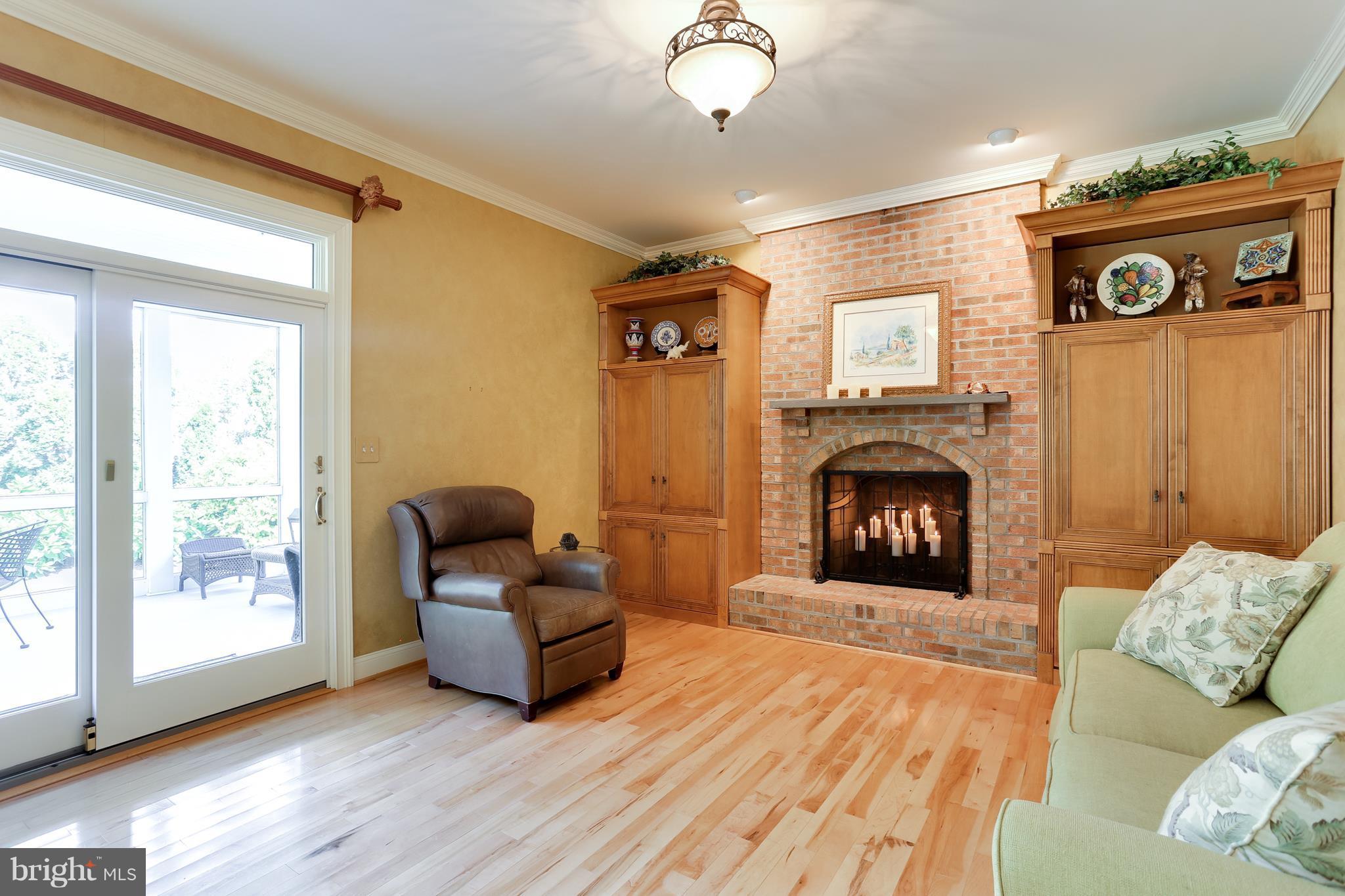 9714 Starling Road Ellicott City, MD 21042 - Photo 14 of 30 Brick Fireplace Flanked By Custom Bookcases~