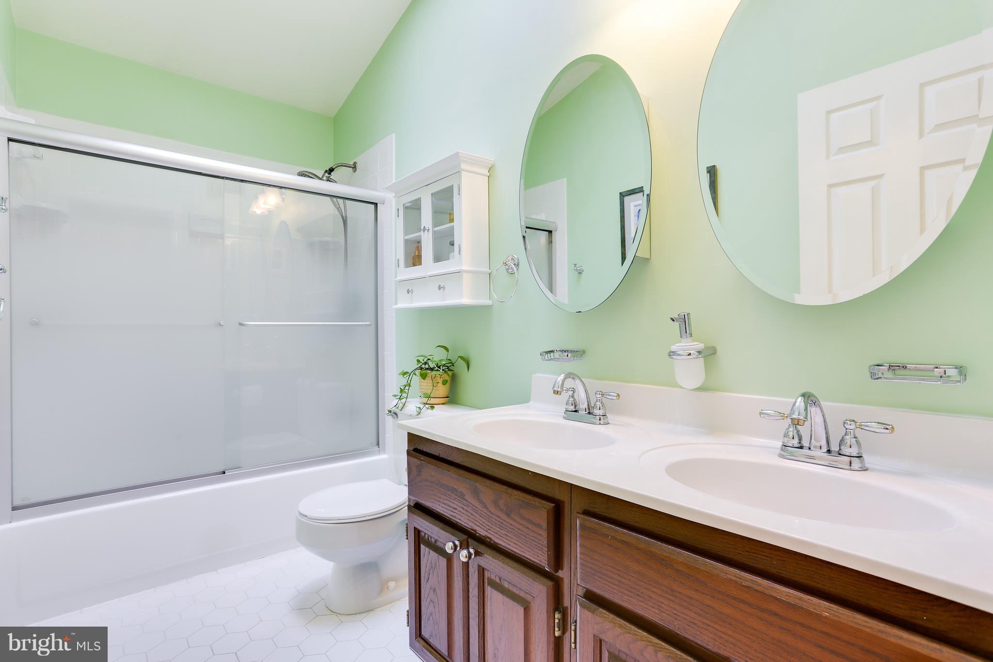 9714 Starling Road Ellicott City, MD 21042 - Photo 27 of 30 Hall Bath With Double Vanity and Skylight
