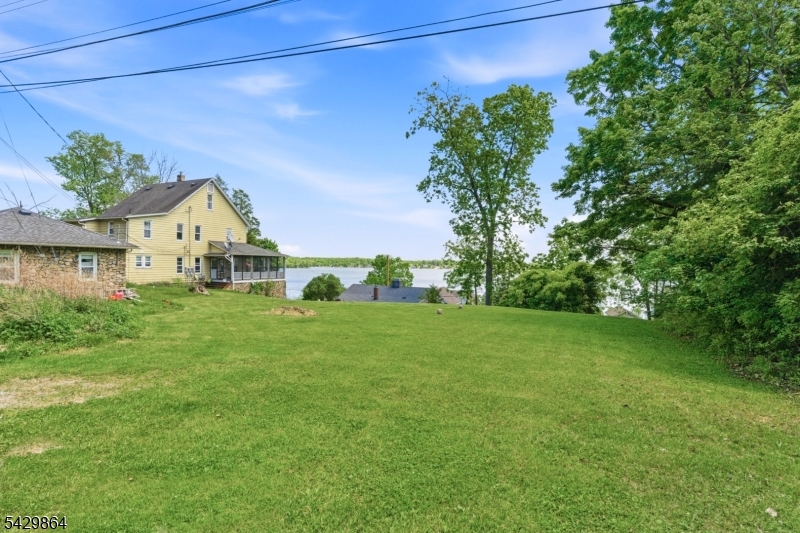 77 Lower North Shore Road Branchville, NJ 07826 - Photo 27 of 38 a view of a house with a yard
