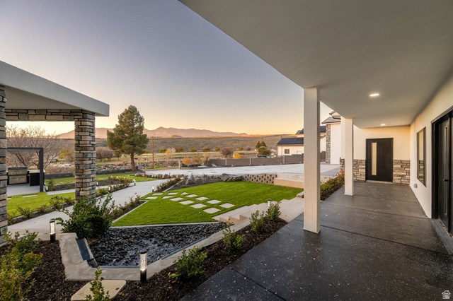 476 Spring Drive Toquerville, UT 84774 - Photo 88 of 95 Yard at dusk with a mountain view, a yard, and a patio