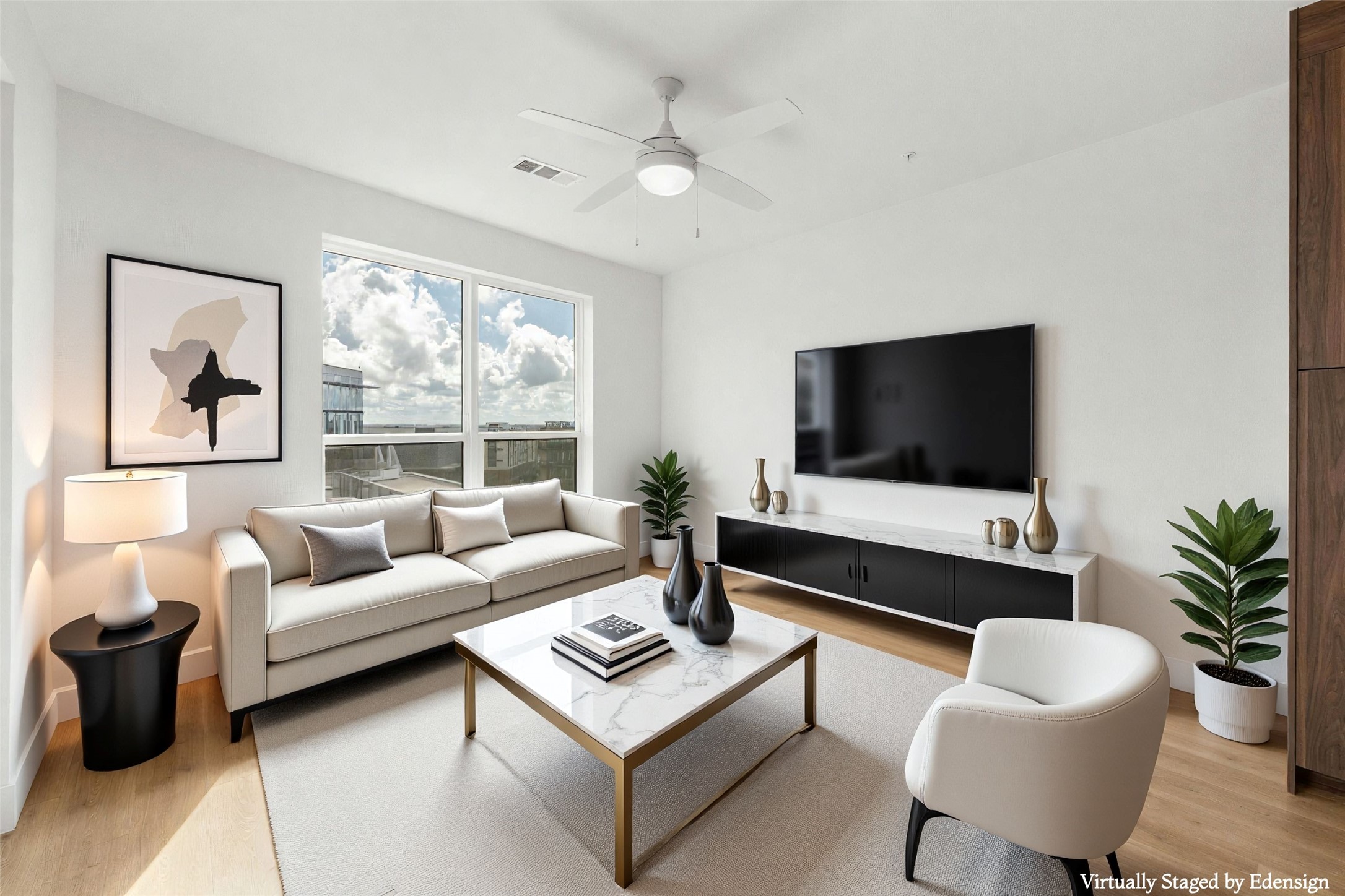 a living room with furniture and a flat screen tv