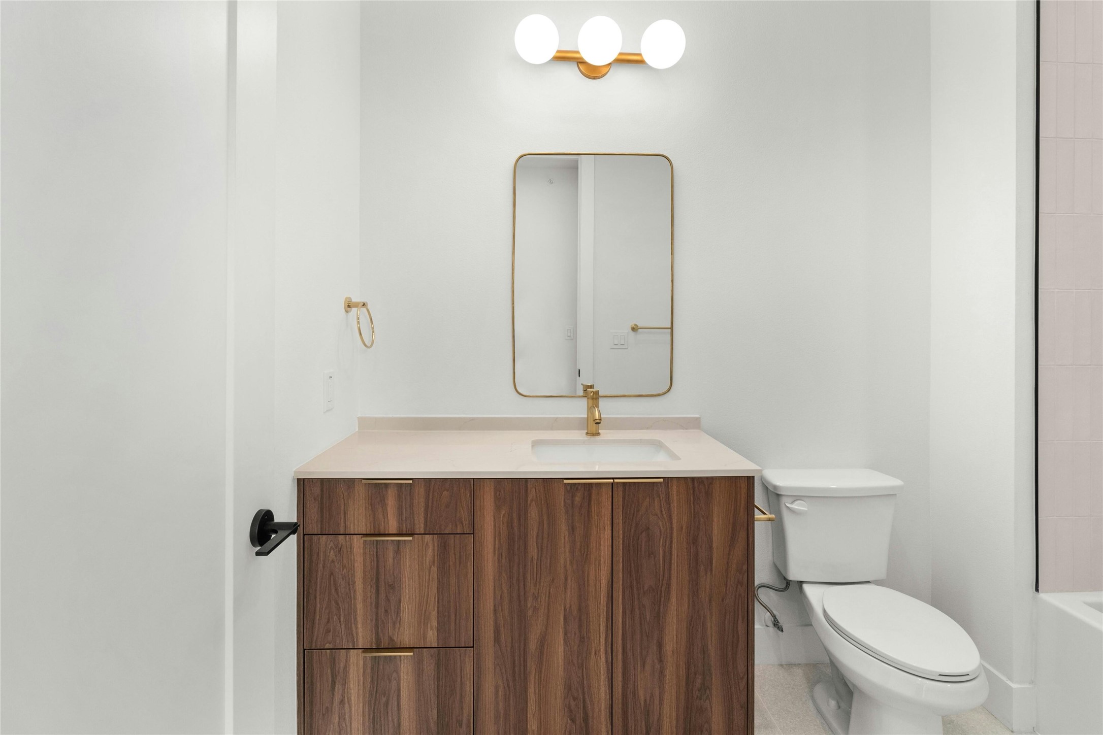 1701 Simond Avenue, Unit 644 Austin, TX 78723 - Photo 11 of 40 a bathroom with a toilet a sink and mirror