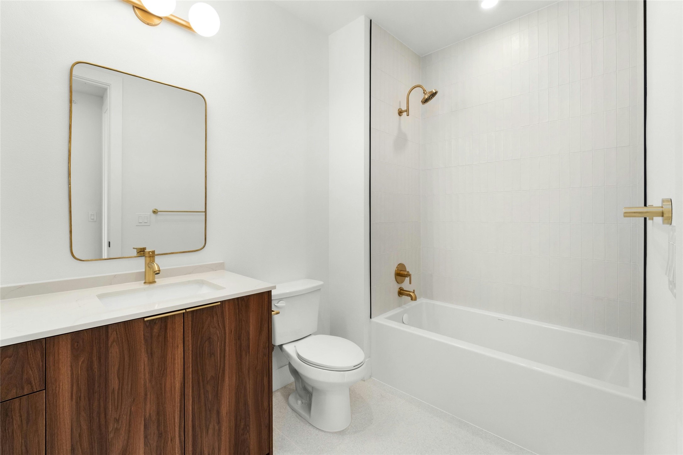 1701 Simond Avenue, Unit 644 Austin, TX 78723 - Photo 12 of 40 a bathroom with a toilet a sink and a bathtub