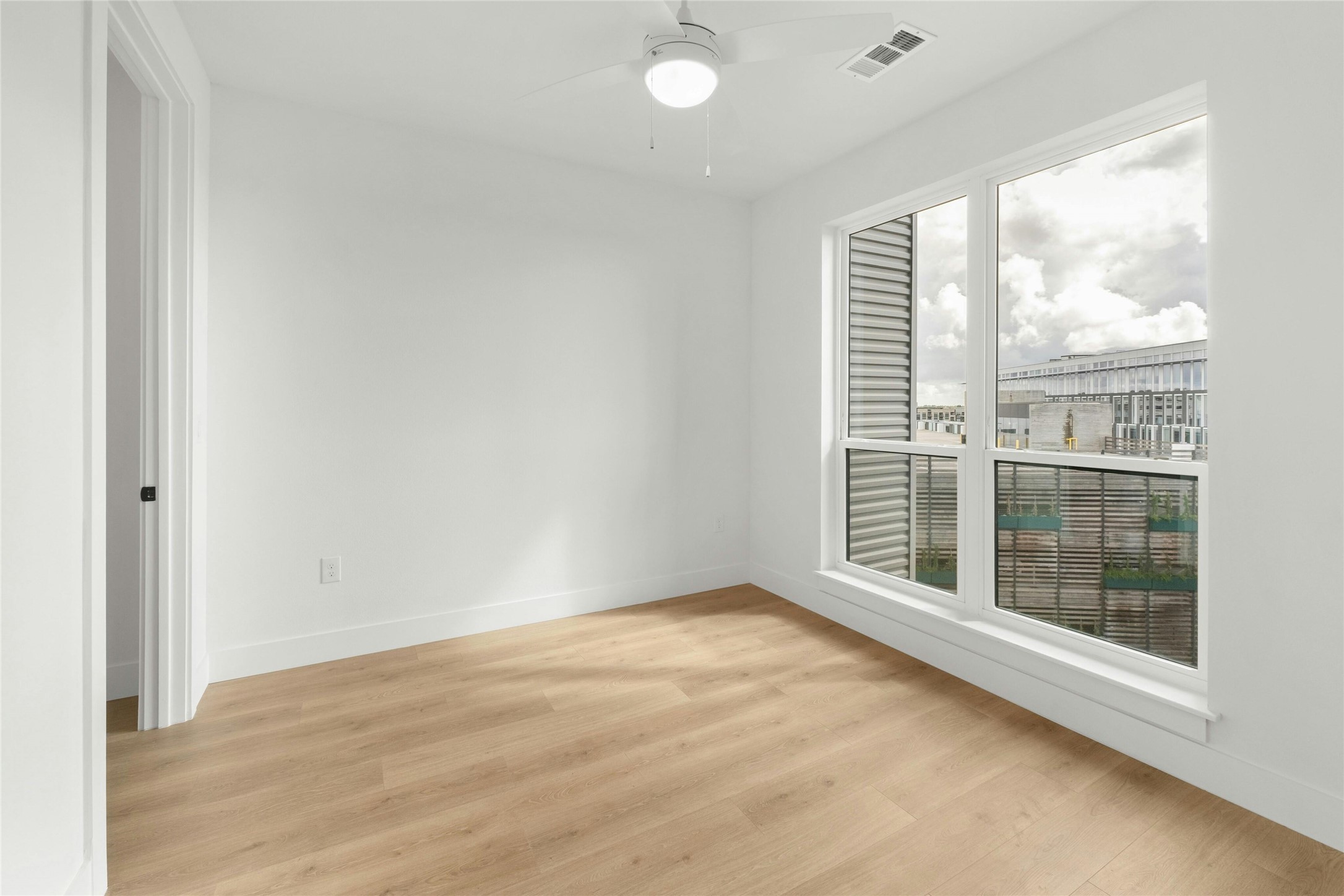 1701 Simond Avenue, Unit 644 Austin, TX 78723 - Photo 14 of 40 an empty room with windows