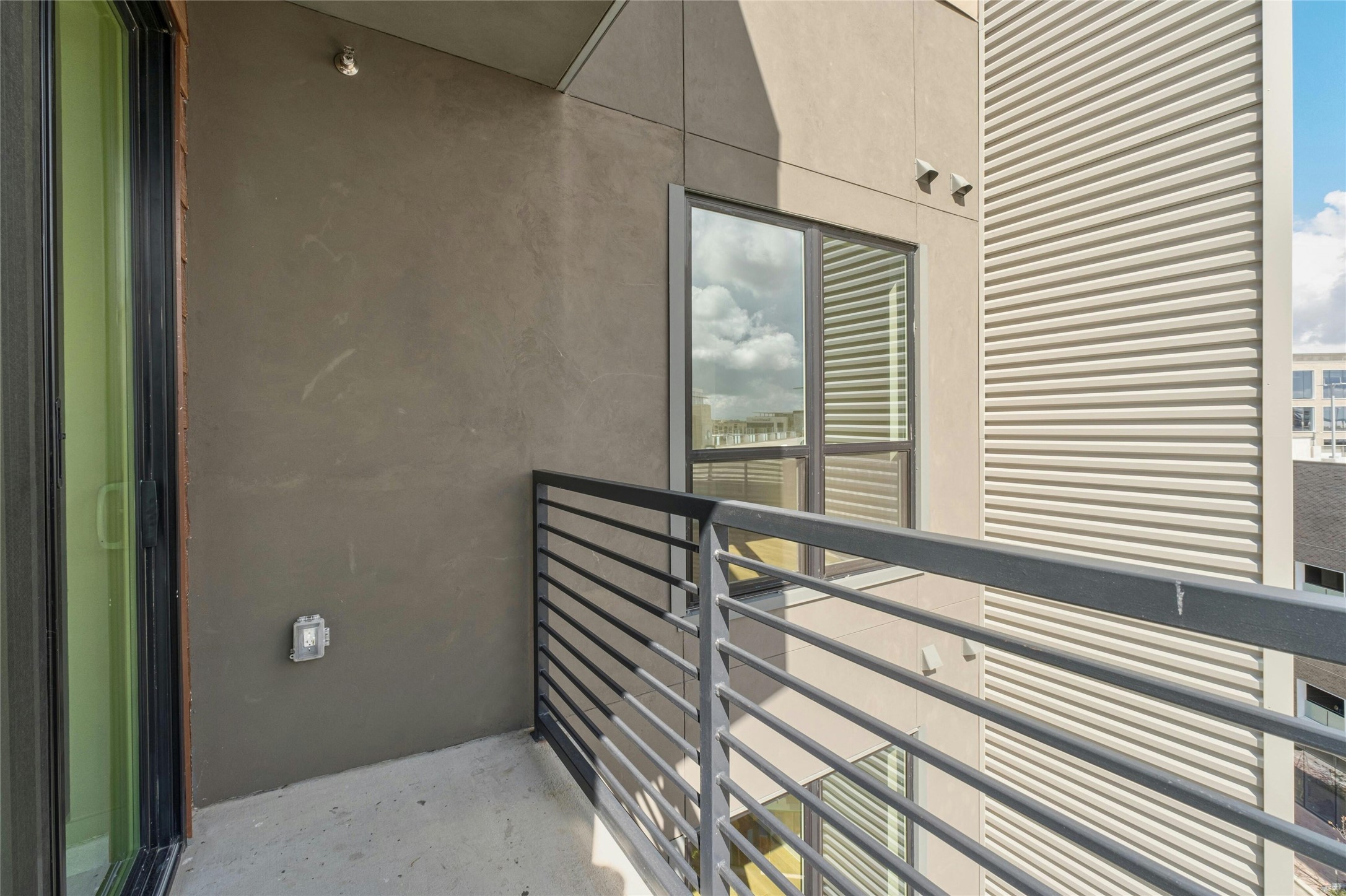 1701 Simond Avenue, Unit 644 Austin, TX 78723 - Photo 20 of 40 a view of a balcony with floor to ceiling windows