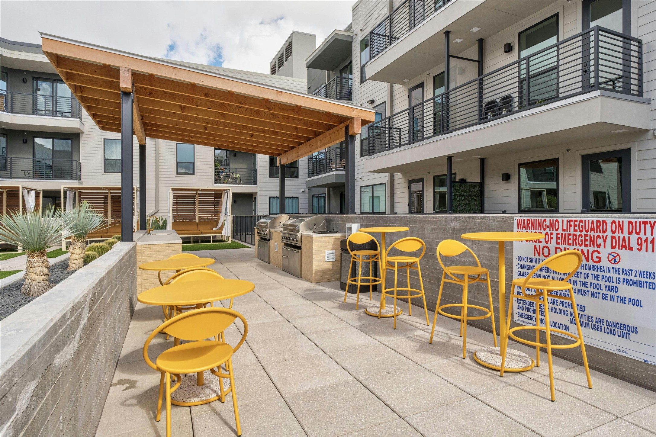 1701 Simond Avenue, Unit 644 Austin, TX 78723 - Photo 29 of 40 a view of a building with seating space and swimming pool