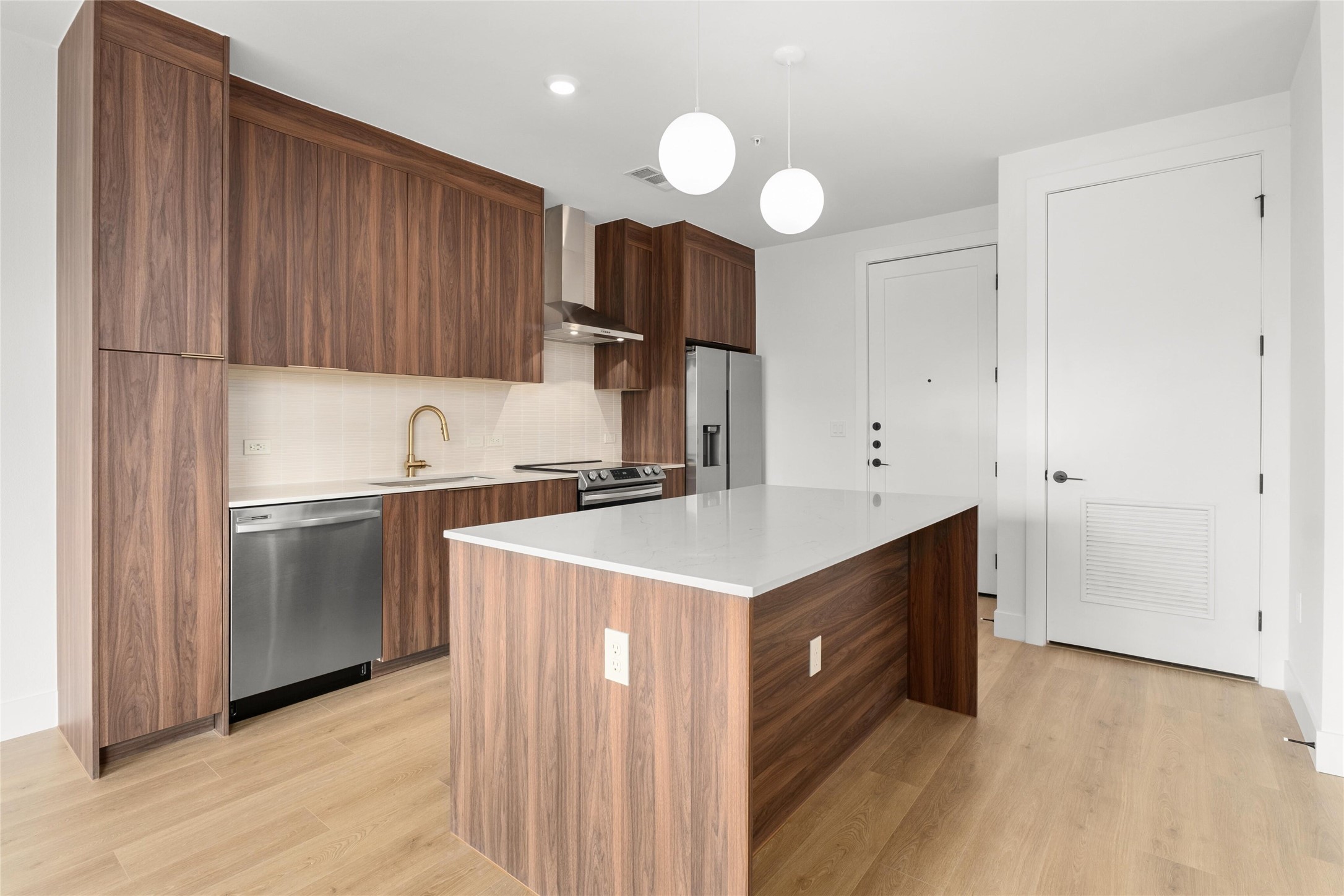 1701 Simond Avenue, Unit 644 Austin, TX 78723 - Photo 8 of 40 a kitchen with a sink cabinets stainless steel appliances and a window