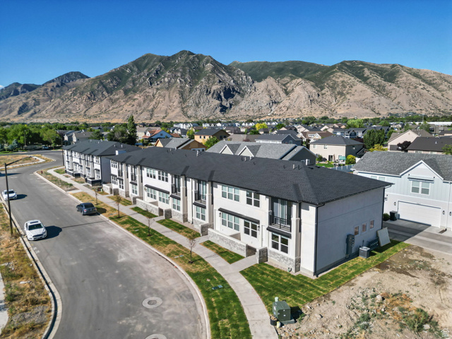 717 South Harrison Drive West Springville, UT 84663 - Photo 24 of 31 Modern townhome-style residences featuring black shingle roofing and light-toned siding