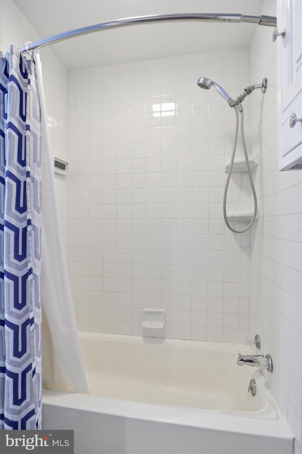 21 Sharpless Street Keyser, WV 26726 - Photo 26 of 33 a bathroom with a shower and a bath tub