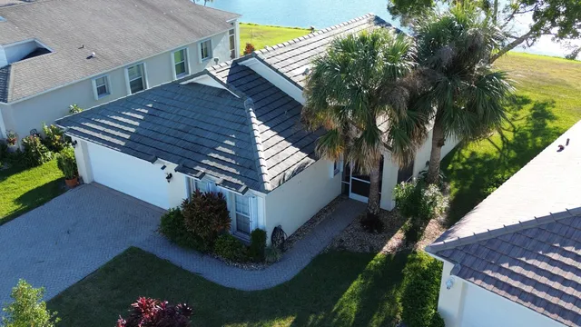 an aerial view of house with yard