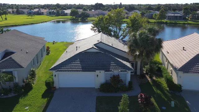 an aerial view of a house with a lake view