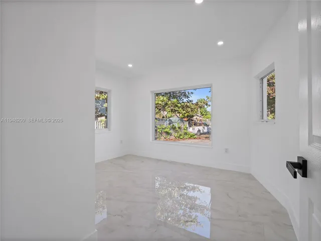 an empty room with windows