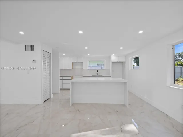 a view of kitchen with wooden floor