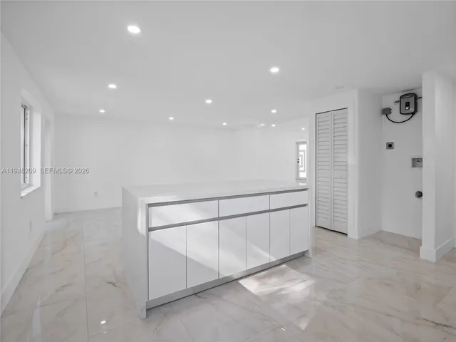 a view of an empty room with windows