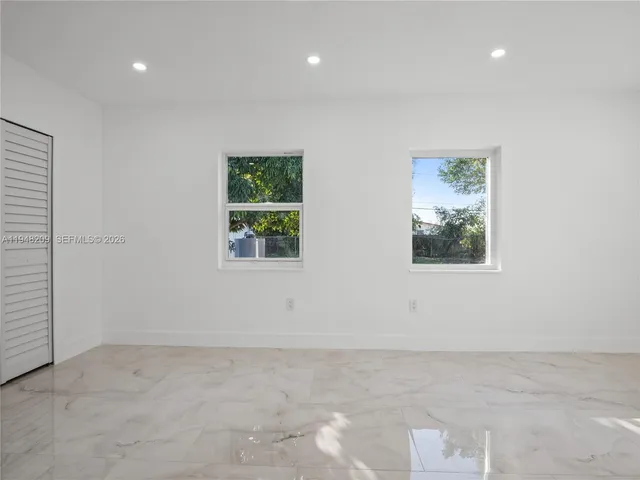 an empty room with windows
