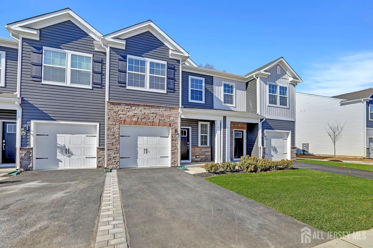 59 Alexander Way Westampton, NJ 08060 - Photo 1 of 18 a front view of a house with a yard and garage