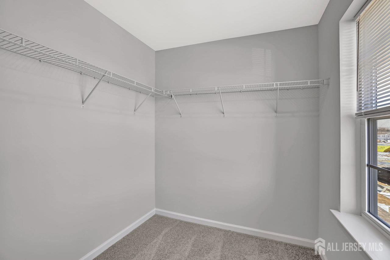 59 Alexander Way Westampton, NJ 08060 - Photo 11 of 18 a view of a room with racks on the wall