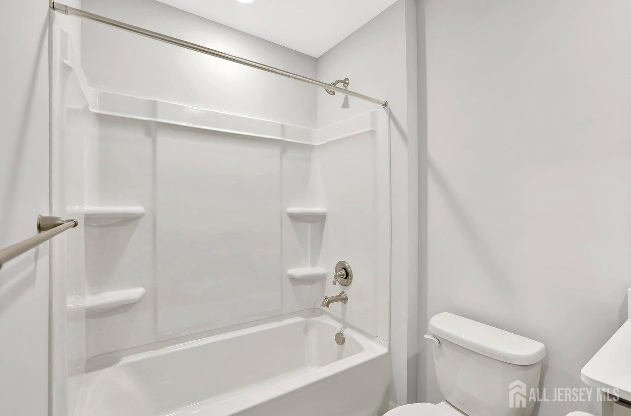 59 Alexander Way Westampton, NJ 08060 - Photo 16 of 18 a bathroom with a bathtub and a toilet