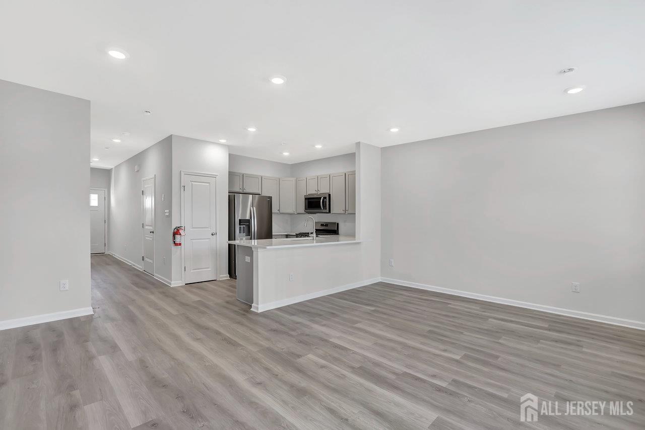 59 Alexander Way Westampton, NJ 08060 - Photo 2 of 18 a view of kitchen with kitchen island white cabinets and wooden floor