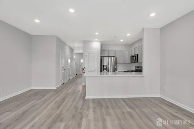 a view of kitchen with wooden floor