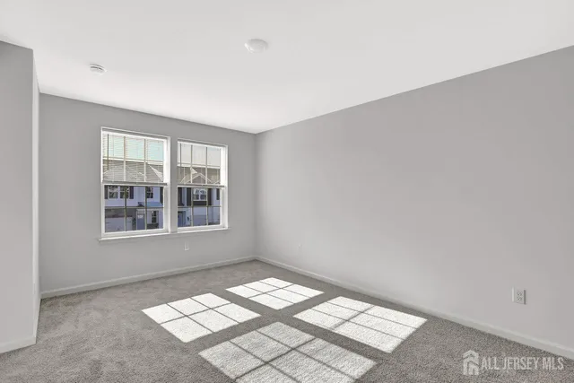 a view of an empty room with windows