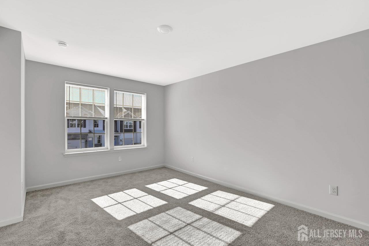 59 Alexander Way Westampton, NJ 08060 - Photo 7 of 18 a view of an empty room with windows