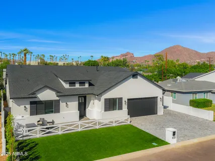 a front view of a house with garage