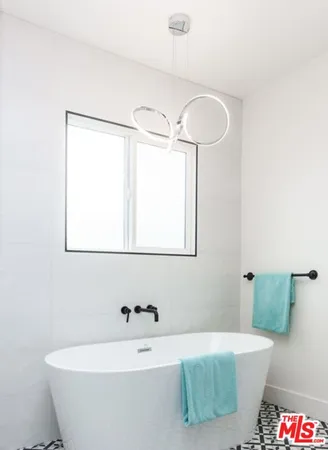 a bathroom with a tub and a shower