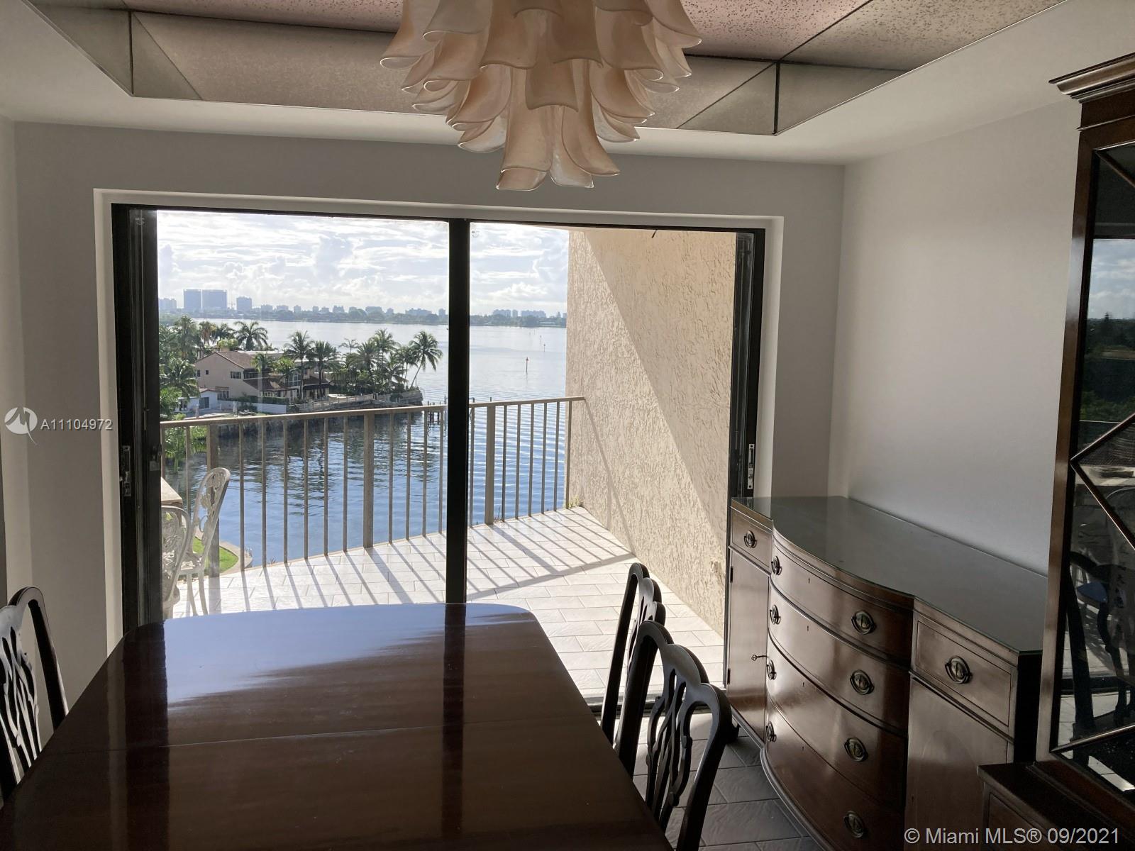 1800 Northeast 114th Street, Unit 703 Miami, FL 33181 - Photo 11 of 33 a view of a balcony with chair