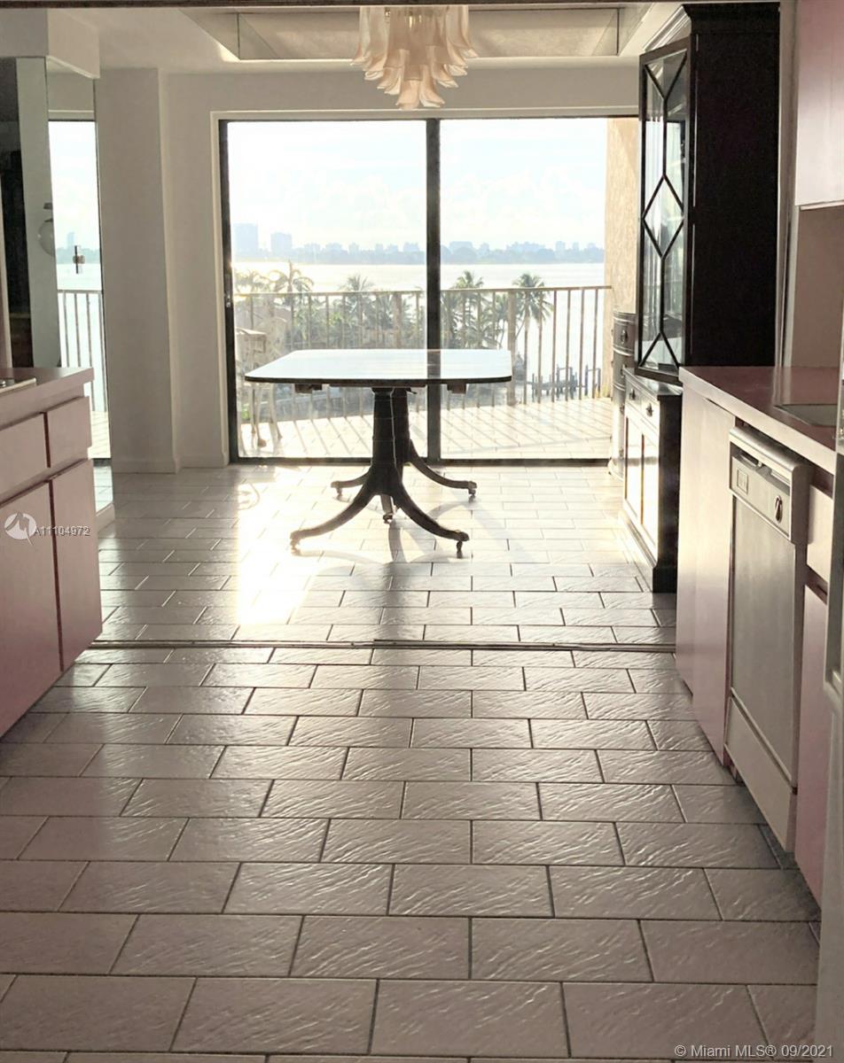 1800 Northeast 114th Street, Unit 703 Miami, FL 33181 - Photo 15 of 33 a view of empty room with wooden floor and floor to ceiling window