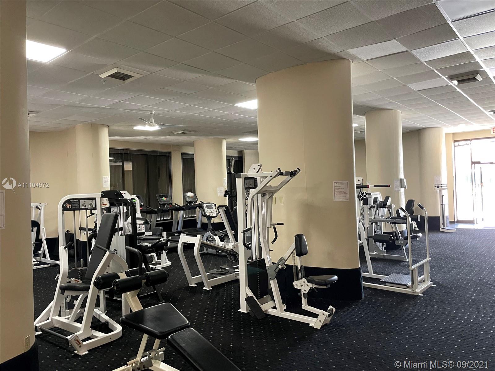 1800 Northeast 114th Street, Unit 703 Miami, FL 33181 - Photo 19 of 33 a view of a room with gym equipment