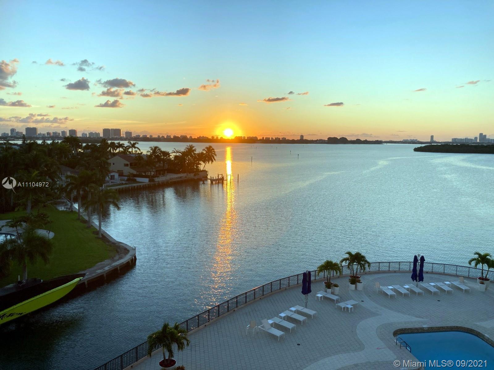 1800 Northeast 114th Street, Unit 703 Miami, FL 33181 - Photo 2 of 33 a view of a lake with a mountain