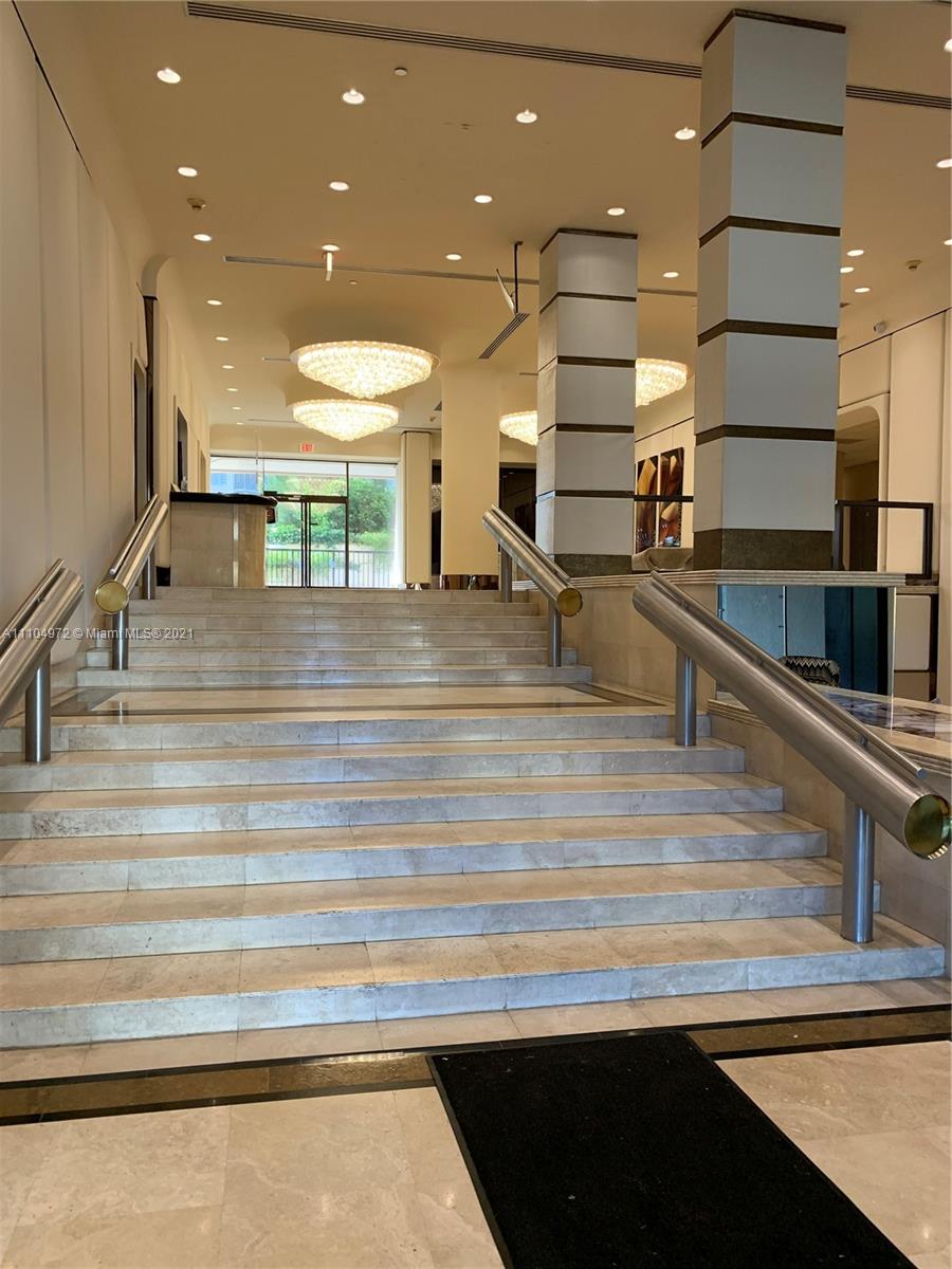 1800 Northeast 114th Street, Unit 703 Miami, FL 33181 - Photo 28 of 33 a view of a room with gym equipment