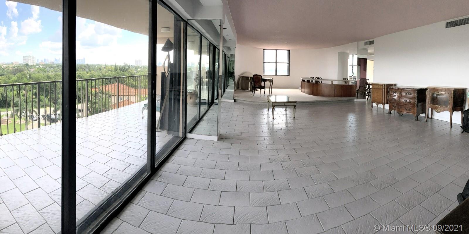 1800 Northeast 114th Street, Unit 703 Miami, FL 33181 - Photo 7 of 33 a lobby with glass door and furniture