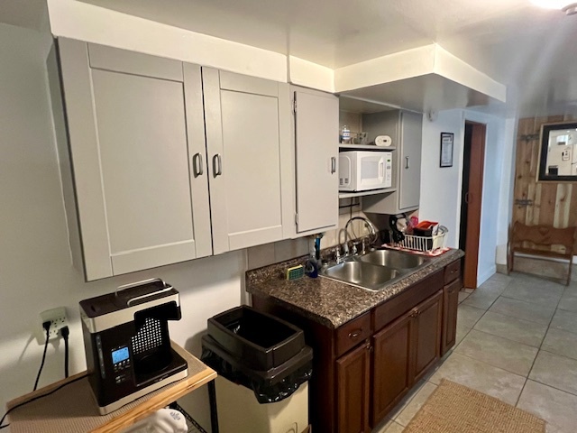 2963 South Archer Avenue Chicago, IL 60608 - Photo 18 of 28 a kitchen with granite countertop a sink stove and cabinets