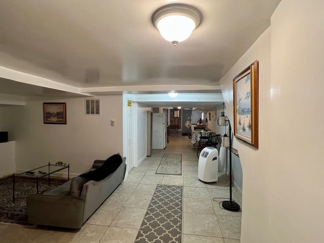 2963 South Archer Avenue Chicago, IL 60608 - Photo 20 of 28 a hallway with couch and white walls