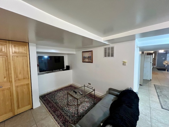 2963 South Archer Avenue Chicago, IL 60608 - Photo 21 of 28 a living room with furniture and a flat screen tv