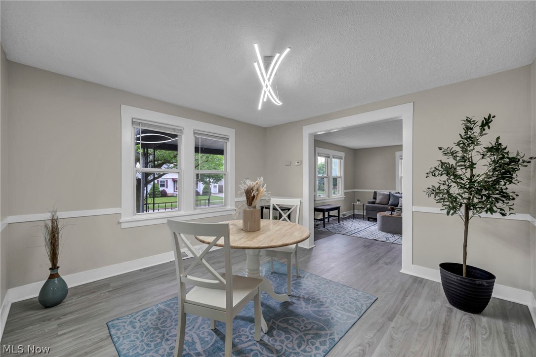 1603 Winchester Road Lyndhurst, OH 44124 - Photo 11 of 34 Bright and inviting dining space featuring new flooring and updated lighting that creates the perfect setting for everyday meals or hosting guests.