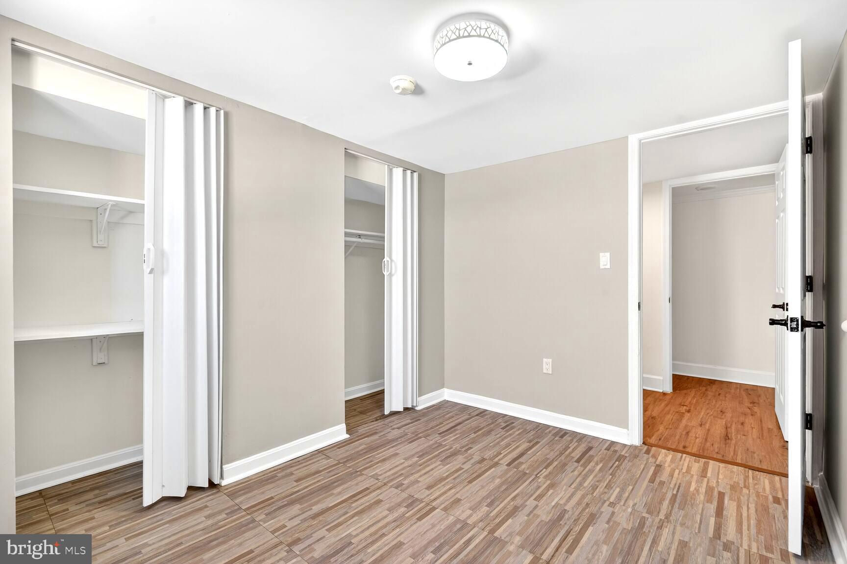 1012 Ward Street Laurel, MD 20707 - Photo 14 of 30 an empty room with wooden floor and windows