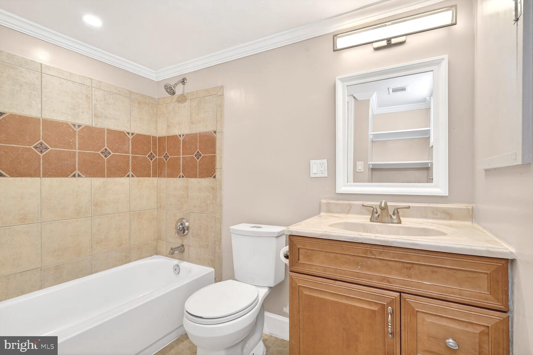 1012 Ward Street Laurel, MD 20707 - Photo 23 of 30 a bathroom with a sink toilet vanity tub and shower