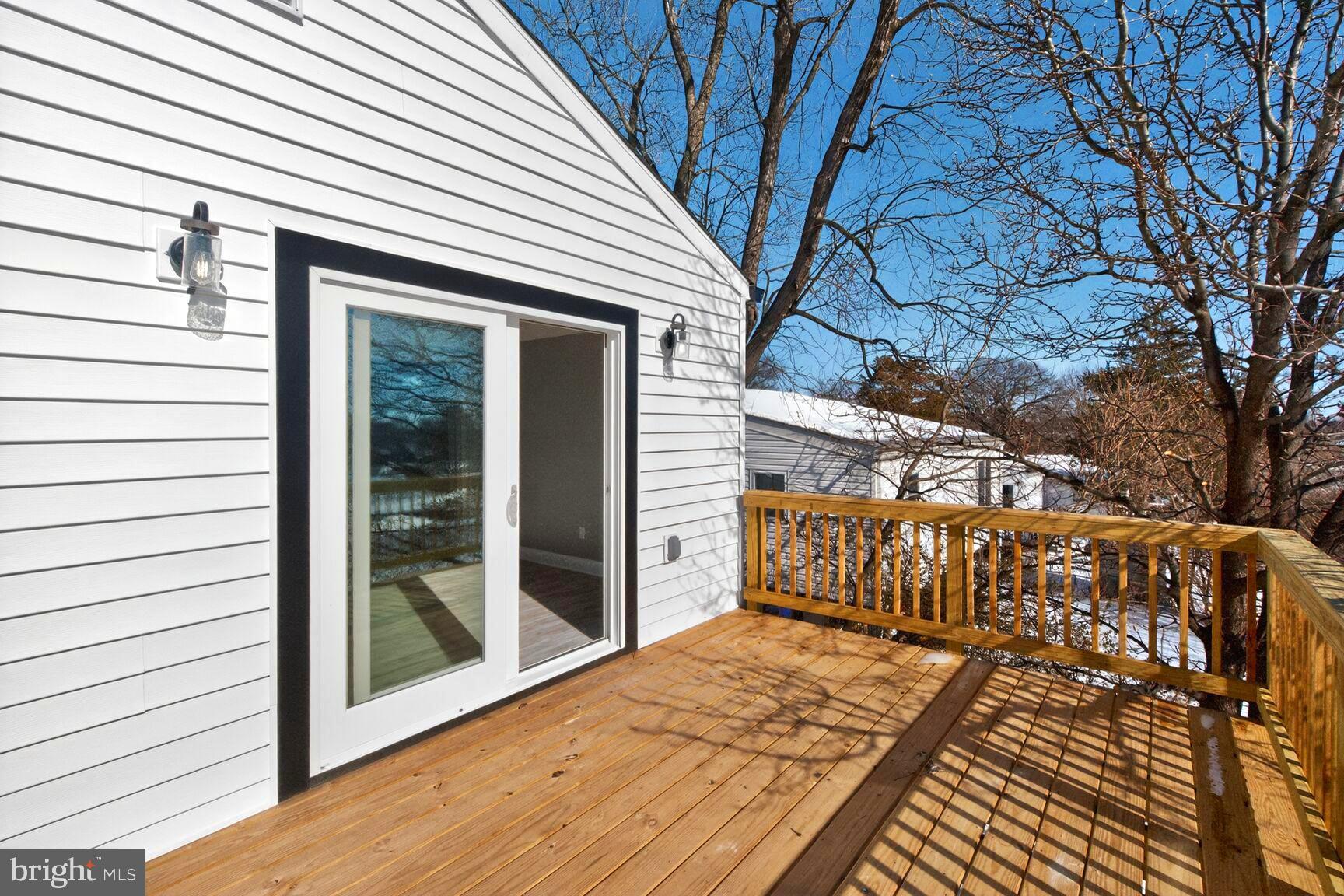 1012 Ward Street Laurel, MD 20707 - Photo 27 of 30 a view of a balcony with wooden floor and fence