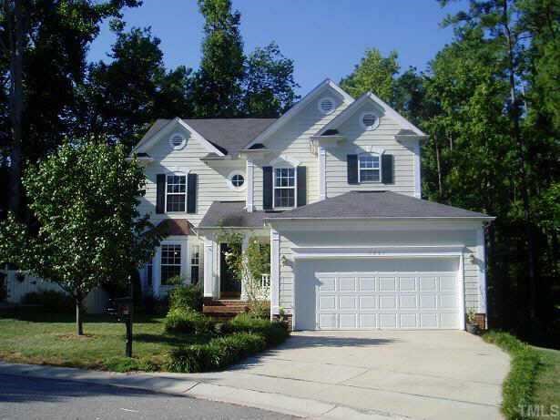 7901 Strawberry Meadows Street Raleigh, NC 27613 - Photo 1 of 1 a front view of a house with a yard and garage
