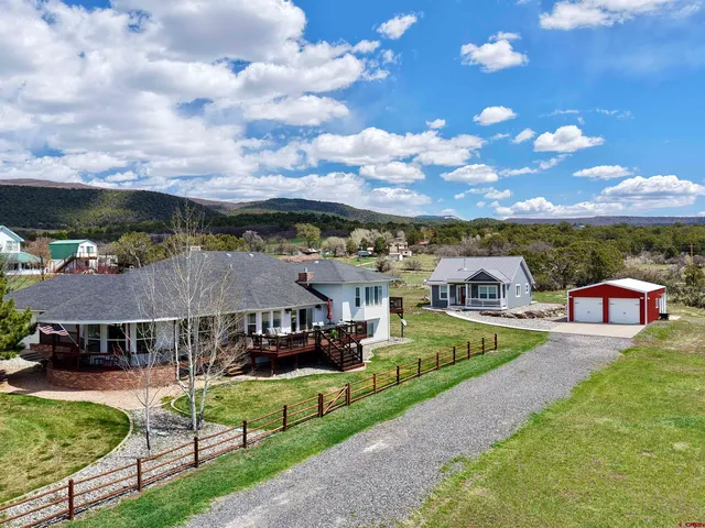 a view of a big house with a big yard