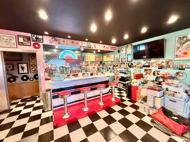 a very nice looking room with lots of storage and a white checkered floor